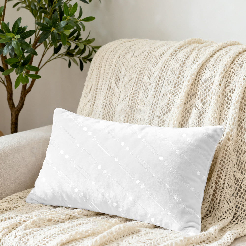 Custom photo pillow on a cream sofa with crochet blanket