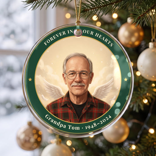 Angel Wings memorial photo ornament in an evergreen name ring, hanging from a gold cord on a Christmas tree